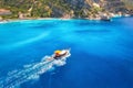 Speed boat in blue sea at sunrise in summer. Aerial view Royalty Free Stock Photo