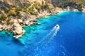 Speed boat in blue sea at sunrise in summer. Aerial view Royalty Free Stock Photo