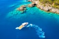 Speed boat in blue sea at sunrise in summer. Aerial view Royalty Free Stock Photo