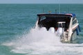 Speed boat engine is runing with sea water splashing