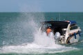 Speed boat engine is runing with sea water splashing