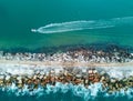 A speed boat and a breakwall aerial view Royalty Free Stock Photo