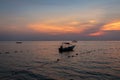 A speed boat at Melina Beach, Tiomen Island, at sunset, Malaysia Royalty Free Stock Photo