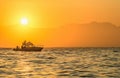 Speed boat in the ocean at sunrise Royalty Free Stock Photo