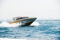 Speed Boat ride in ocean sea waves daytime summer background city