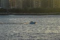 A speed boat riding along the East River. Royalty Free Stock Photo