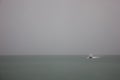 Speed boat sailing in fog, rain,Travel and transportation. Royalty Free Stock Photo