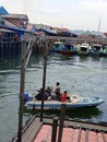 The speed boat is departing from the port of the new village, Balikpapan to the port of Penajam, Indonesia Royalty Free Stock Photo