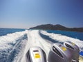 A speed boat with three engines sailing back to shore that made the white wave interspersed. Royalty Free Stock Photo