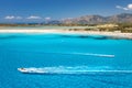 Speed boat in transparent blue water and white sandy beach Royalty Free Stock Photo