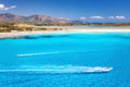Speed boat in transparent blue water and white sandy beach Royalty Free Stock Photo