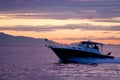 Speed boat on violet sunset Royalty Free Stock Photo