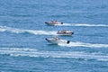 Speed boats in a blue sea shore