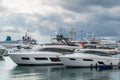 Speed boats at harbor. Power boats moored in marina. Sea coast pier Royalty Free Stock Photo