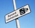 Speed camera warning sign against blue sky Royalty Free Stock Photo