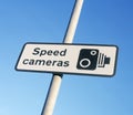 Speed camera warning sign against blue sky Royalty Free Stock Photo