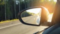 Speed car driving, view from the mirror on an empty highway, motion blur Royalty Free Stock Photo