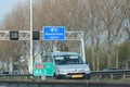 Speed and distance sign in the shoulder of motorway A20 at 44,3 left side in the Netherlands.