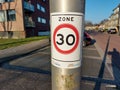 Speed limit reminder on lightning pole in residential area