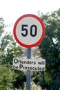 Speed limit sign covered by a spider web Royalty Free Stock Photo
