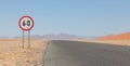 Speed limit sign at a desert road in Namibia Royalty Free Stock Photo