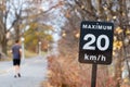 Speed limit sign, 20 kilometers per hour for bicycle lanes in park Royalty Free Stock Photo