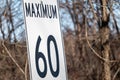 Speed limit sign says maximum 60