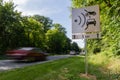 Speed limit speed camera sign close to the road Royalty Free Stock Photo