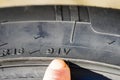 The speed and load index markings on the sidewall of the tire