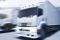 Speed Motion Blur of Cargo Trucks Driving on The Road. Industry Road Freight Truck. Logistic and Cargo Transport concept. Royalty Free Stock Photo