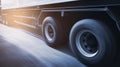 Speed motion blur of long trailer truck driving on road. Fast spinning wheels. Business loistics. Cargo freight truck. Royalty Free Stock Photo