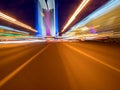 Speed motion on the neon glowing road at dark. Royalty Free Stock Photo