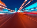 Speed motion on the neon glowing road at dark. Royalty Free Stock Photo