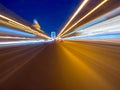 Speed motion on the neon glowing road at dark. Royalty Free Stock Photo