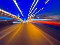 Speed motion on the neon glowing road at dark. Royalty Free Stock Photo