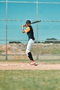 Speed and quickness to react to the ball are important. a baseball player swinging his bat while out on the pitch.