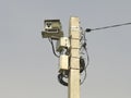 Speed radar camera detector mounted on the pole front view Royalty Free Stock Photo