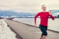 Speed runer on the winter road Royalty Free Stock Photo