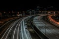 Speed Traffic at Dramatic Sundown Time - light trails on motorway highway at night, long exposure abstract urban background Royalty Free Stock Photo