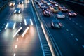 light trails on motorway highway at night, long exposure abstract urban background Royalty Free Stock Photo