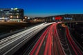 Cars at night on a highway. Light trails