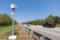 Speed trap surveillance camera along highway to control speeding Royalty Free Stock Photo