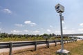 Speed trap surveillance camera along highway to control speeding Royalty Free Stock Photo