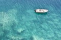 Speedboat anchored in shallow turquoise water Royalty Free Stock Photo