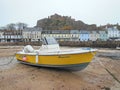 Speedboat in harbour at low tide