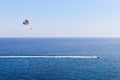 Speedboat and parasailing on blue sea Royalty Free Stock Photo