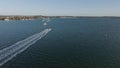 Speedboat sailing along coastline