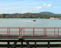 Speedboat by the water with mountain in the background