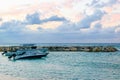 Speedboats/ Motorboats docked on the beach at sunset on tropical Caribbean island. Holiday luxury resort setting. Royalty Free Stock Photo