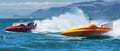 Speedboats race at high velocity, churning the ocean water with powerful, in an intense display of water sportsmanship.